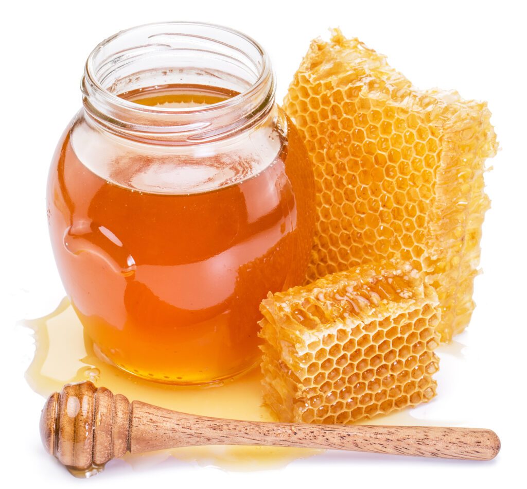 Honeycomb and pot of fresh honey. High-quality picture contains clipping paths.
